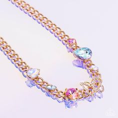 A succession of various gleaming, multicolored gems encased in gold fittings are affixed to a high-sheen, thick gold curb chain, adding dramatic dimension and color to an industrial statement. An airy gold butterfly frame adorned in white rhinestones is featured on the center of the gold curb chain for a touch of whimsicality. Features an adjustable clasp closure. Due to its prismatic palette, color may vary. Sold as one individual necklace. Includes one pair of matching earrings. September 2023 Gold Curb Chain, Butterfly Necklace Gold, Palette Color, Jewelry Accessories Ideas, Butterfly Frame, Paparazzi Accessories, White Rhinestone, Latest Jewellery, Gold Butterfly