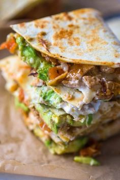 a close up of a quesadilla stacked on top of each other