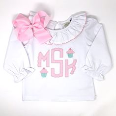 Our Scallop Monogram Applique Girls Top is perfect for your little one. Choose your favorite style top, your fabric and mini embroidery design. Cotton Long Sleeve Top With Appliques, Customizable Cute Cotton Tops, Fitted White Tops With Machine Embroidery, Fitted White Top With Machine Embroidery, White Fitted Top With Machine Embroidery, Fitted Long Sleeve Top With Custom Embroidery, Customizable Playful Cotton Tops, Playful Long Sleeve Customizable Tops, Customizable Cute Long Sleeve Top