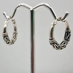 ABSOLUTELY SHIMMERING STERLING SILVER Hinged Hoop EARRINGS !! A delight for your ears, these wonderful sterling silver hoop earrings has been hand made using sterling silver wire in an exotic design. These hoops are hinged to make them easier to put on. This sterling silver shimmers with your every move! NOTE: Images do not reflect number and size. Please see detail and table for information. Quantity: 1 Pair of Earrings Material Type: Sterling Silver Size: 17x3mm Color: Silver Legend: What a fu Wolf Pendant Necklace, Bead Studio, Semiprecious Stone Jewelry, Bone Beads, Sterling Silver Hoop Earrings, Sterling Silver Hoops, Silver Hoops, Silver Hoop Earrings, Silver Wire