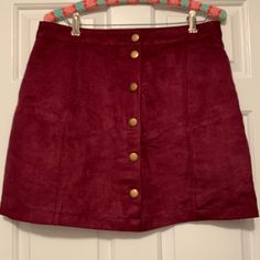 Wine-Colored Faux Suede Skirt. Gold Snaps On Front. Never Worn. Size 10. Burgundy Skirt For Fall, Red Mini Skirt With Button Closure, Red Lined Mini Skirt For Fall, Casual Burgundy Skirt For Fall, Faux Suede Skirt, Suede Skirt, Wine Colored, Faux Suede, Old Navy