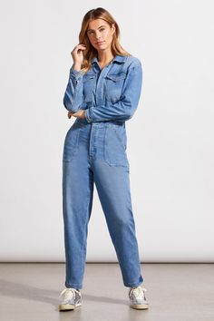 Embrace utilitarian chic with our long-sleeve jumpsuit, expertly crafted from lightweight denim with subtle faded details. Its button-up front and crisp collar offer a structured silhouette, while the relaxed fit and stretchy back elastic ensure all-day comfort. Practicality meets style with pockets throughout, and a cropped 26" inseam allows you to move effortlessly. Style: 5547O-4798-0293 Utility Button-up Denim Jumpsuit, High Rise Denim Blue Utility Jumpsuit, Fall Light Wash Jumpsuits And Rompers With Pockets, Utility Jumpsuits And Rompers With Pockets In Medium Wash, High Rise Denim Jumpsuit With Pockets In Utility Style, Fall Light Wash Denim Jumpsuit With Pockets, Button-up Denim Blue Jumpsuit With Pockets, Light Wash Denim Jumpsuit With Pockets, Fall Light Wash Denim Jumpsuit For Work