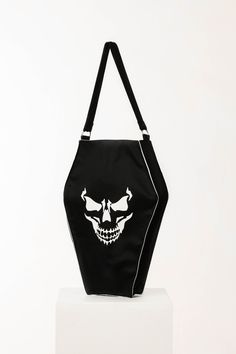 "Coffin shaped tote back with a spooky skull.  Can be personalized. Fabric: 100 % cotton Print: vinyl Approximate Dimensions: Width: 30cm/12\" Height: 44cm/17\" We are always happy to customize our products to suit your needs, please get in touch if you would like any further changes. To visit our shop for full Halloween collection, please click here: www.etsy.com/shop/DecorDora Please click ❤ FOLLOW SHOP button to save this shop for more cute home décor and gift ideas. Thank you for stopping by Black Tote Shoulder Bag For Halloween, Gothic Skull-shaped Bag With Skull Print, Black Skull-shaped Bag With Skull Print, Black Skull Bag For Halloween, Black Skull-shaped Bag For Halloween, Gothic Tote Bags For Halloween, Gothic Halloween Tote Bags, Rectangular Skull Print Bag For Halloween, Black Skull Print Bag For Halloween