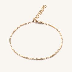 Designed with mixed square and rectangular links, the Dayna Bracelet will add a unique texture to your stack. Designed as part of our BBT Luxe collection, you'll never have to take this bracelet off, as we pride ourselves on fine jewelry without any of the markups. 14k Solid Gold Length: 6" + 1" Extender Width: 2 mm Pieces from this collection are not eligible for any discounts or promotions Make your jewelry last! Click here for jewelry care. Need a gift box? We got you. Adjustable Jubilee Chain Bracelet With Rectangular Links, Modern Chain Bracelet With Rectangular Links And Extender, Modern Rectangular Tarnish Resistant Bracelets, Modern Tarnish-resistant Rectangular Bracelets, Modern Bracelet With Adjustable Chain And Rectangular Links, Sterling Silver Bracelet With Rectangular Links, Dainty Paperclip Bracelet With Rectangular Jubilee Links, Dainty Paperclip Bracelet With Jubilee And Rectangular Links, Minimalist Box Chain Bracelet With Rectangular Links