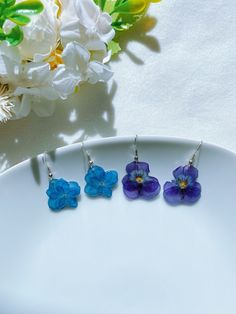 Welcome to GeminiAngieShop! More colors are coming! All my items are light, usually no shipping fees for additional items. All items are handmade in USA and in a pet / smoke free environment. Real pressed flower earrings are made with hypoallergenic hooks, real dried flowers dangle. Each pair comes with rubber earrings. Item's color might vary from monitor to monitor. The earrings are handmade by me, size might be a little different. They are perfect gifts for girls and adults. I have more handmade earrings and gifts in my store, please check it. Tracking Included with every order Rubber Earrings, Dried Flower Earrings, Real Flower Earrings, Pressed Flower Jewelry, Resin Earring, Purple Pansy, Flower Jewelry, Pressed Flower, Dried Flower