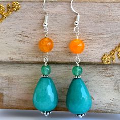 ONE OF A KIND A beautiful pair of earrings made of teardrop green jade beads,  emerald faceted and orange dragon veins agate beads. The earrings are about 5 cm (2 inches) long. They come in a gift box. Orange Gemstone Dangle Earrings, Orange Gemstone Drop Earrings, Jade Dangle Earrings For Pierced Ears, Orange Teardrop Gemstone Earrings, Elegant Orange Earrings With Natural Stones, Turquoise Jade Earrings With Natural Stones, Orange Natural Stones Drop Earrings, Orange Natural Stone Drop Earrings, Turquoise Jade Earrings For Gift