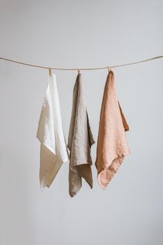 three towels hanging on a clothes line