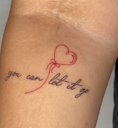 a tattoo saying you can let it go on someone's arm