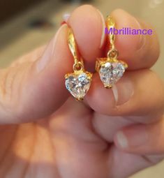 Solid 22k gold Dangling heart shape Cz stones earrings 916 Gold Metal Gold Purity : 916 GOLD Stones : cubic zirconia (CZ stones) Weight : 2.60-2.70 grams hallmark : 916 stamp Appx Size : see pic with ruler Colour : YELLOW gold Hallmark : Hallmarked 916 Design : Elegant & beautiful heart shape stones dangling earrings. Brandnew genuine authentic 22k solid gold / 916 gold Gold Plated Heart Cut Earrings For Anniversary, Gold Cubic Zirconia Dangle Heart Earrings, Gold Cubic Zirconia Heart Dangle Earrings, Gold Heart Earrings With Prong Setting For Wedding, Cubic Zirconia Heart Earrings For Wedding, Heart-shaped Gold Cubic Zirconia Earrings, Gold Dangle Heart Earrings With Cubic Zirconia, Yellow Gold Cubic Zirconia Heart Earrings For Wedding, Gold Diamond Heart Earrings For Wedding