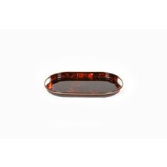 an oval shaped tray with metal handles on a white background, it is made from tortoise shell