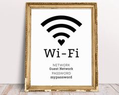 a framed wi - fi sign on a wooden floor