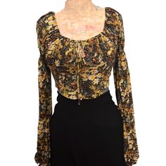 Nwt Long Sleeve Black Crop Top With Autumn Tone Floral Pattern Low Cut Drawstring Tie In Front To Adjust Neckline Elastic Cuffs On Sleeves Stretchy Soft Fabric Smocking In Back Urban Outfitters Xsmall Ptp14, Length14 Small Ptp14.5, Length15 Medium Ptp15, Length16 Urban Outfitters Fitted Floral Print Tops, Fitted Floral Print Top From Urban Outfitters, Fitted Urban Outfitters Floral Print Tops, Fitted Floral Print Tops By Urban Outfitters, Urban Outfitters Orange Tops For Fall, Fitted Fall Blouse From Urban Outfitters, Urban Outfitters Bohemian Fitted Tops, Fitted Blouse From Urban Outfitters For Fall, Bohemian Fitted Top From Urban Outfitters