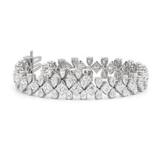 Designed to leave a lasting impression, this diamond bracelet proudly flaunts responsibly sourced diamonds expertly mounted on claw-prong baskets. A combination of pear and princess-cut diamonds make up the awe-inspiring beauty of this jewel.