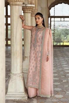 Luxury Pink Pakistani Wedding Dress in Kameez Trouser Style is embellished with silverwork and hand-crafted details of ornaments. The lavish designs on this Pakistani Dress make it an epitome of beauty and your foremost priority for the wedding. Organza Salwar Kameez With Naqshi For Reception, Silver Anarkali Kurta For Wedding, Elegant Georgette Lehenga With Naqshi Detailing, Silver Semi-stitched Salwar Kameez For Eid, Eid Silver Salwar Kameez With Dabka Work, Traditional Silver Salwar Kameez For Wedding, Wedding Salwar Kameez With Mirror Work, Wedding Floor-length Jamawar Kurta, Silver Kurta With Zari Work For Wedding