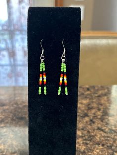 Beautiful beaded drop earrings perfect for those who like a minimalist design. 2 inches long, including hook. Hand made in Oklahoma by an enrolled citizen of Cherokee Nation. Many primary colors to choose from. Hypoallergenic stainless steel hooks used. Minimalist Drop Earrings With Dangling Beads, Minimalist Beaded Dangle Earrings, Minimalist Jewelry With Dangling Round Beads, Adjustable Beaded Earrings With Dangling Beads For Everyday, Minimalist Adjustable Earrings With Dangling Beads, French Hook Beaded Drop Earrings, Adjustable Dangle Beaded Earrings For Everyday, Minimalist Beaded Earrings For Everyday, Everyday Beaded Dangle Earrings