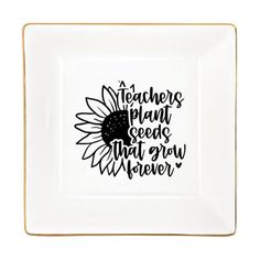 a white plate with black lettering on it that says teachers plant seeds that grow wherever