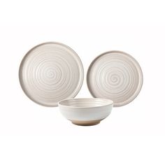 three white bowls and two plates on a white background, one with swirls in the center