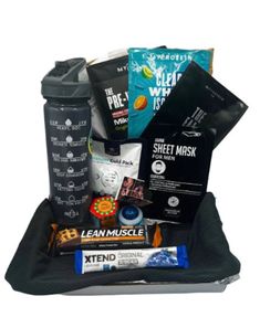 an open black bag with snacks and drinks in it