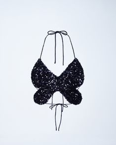 Pretty to see, hard to catch 🦋 This black butterfly top, made from sequin fabric and complete with a halter top style and tie back, will have them seeing stars in your eyes & your top 🤩 Stars In Your Eyes, Pop Outfits, Butterfly Top, Black Butterfly, Sequin Fabric, Amelie, Tie Backs, Tie Back, Halter Top