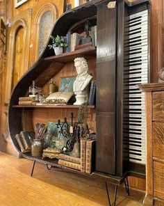 an old piano with books and other items on it