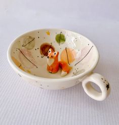 a small bowl with a fox design on it