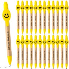 a bunch of pens with smiley faces on them