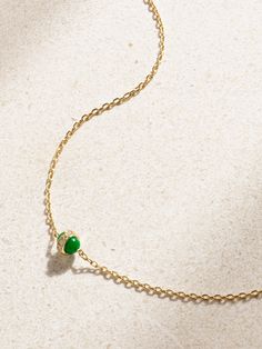 L'Atelier Nawbar's necklace is part of the brand's 'Atoms' collection, which is inspired by the ever-evolving namesake form of chemistry. Handcrafted from 18-karat gold, it's strung with a green enamel charm that represents 'Chlorine'. A dusting of diamonds gives it just the right amount of sparkle. Elegant Yellow Gold Emerald Necklace With Adjustable Chain, Pendant Necklace With Cable Chain For May Birthstone, May Birthstone Cable Chain Pendant Necklace, May Birthstone Pendant Necklace With Cable Chain, Yellow Gold Briolette Necklace For May Birthstone, Elegant Adjustable May Birthstone Necklaces, Yellow Gold Necklace With Cable Chain For May Birthstone, Yellow Gold Single Strand Emerald Necklace Gift, Enamel Necklaces