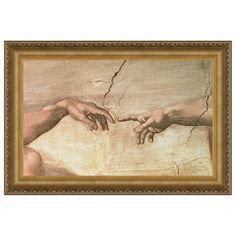 two hands touching each other in front of a painting with gold frame on the wall