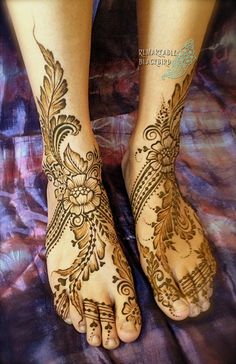 the feet are decorated with henna and flowers