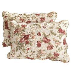 two pillows with red flowers on them, one is white and the other is beige