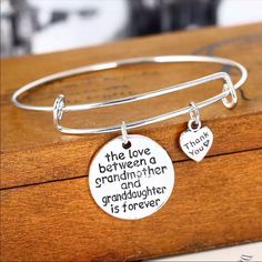 The Love Between A Grandmother And Granddaughter Is Forever Beautiful New Bangle Bracelet Perfect For Grandma Family Bangle Bracelet Material: Zinc Alloy Pendant Size: 3cm (Diameter) Chain Length :Approx 7.5''(Inches) Color: Sliver Packing: 1pc Bracelet Mother's Day Metal Charm Bangle Bracelet, Adjustable Heart Bangle For Mother's Day, Metal Bracelets For Anniversary And Mother's Day, Adjustable Metal Heart Bracelet For Mother's Day, Metal Bracelet For Anniversary And Mother's Day, Metal Bracelets For Mother's Day Anniversary, Metal Bracelets For Friendship On Mother's Day, Mother's Day Friendship Charm Bangle Bracelet, Mother's Day Friendship Bangle Charm Bracelet