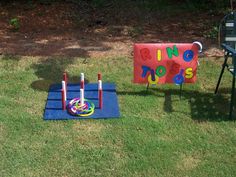 an inflatable ring toss game is set up on the lawn for kids to play