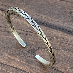 ❋ Handmade Sterling Silver Flexible Braided Cuff Bracelet, Natural look, for Man or Woman ❋Adjustable, Flexible, The Length end to end from the outside) about 6 7/8 inches ( / 17.5cm). ❋Size: M-L for women, S-M for men ❋ Metal Purity: 95% Silver. (Purer than 925 Sterling Silver). We also have Braided Silver Matching Earrings and Rings To browse some more of our silver jewelry collection you can click on the following links: https://www.etsy.com/shop/SilverShapes Earrings: https://www.etsy.com/sh Bohemian Adjustable Engraved Bangle, Traditional Adjustable Engraved Braided Bracelets, Traditional Engraved Adjustable Braided Bracelets, Adjustable Stamped Sterling Silver Bangle, Traditional Adjustable Engraved Braided Bracelet, Adjustable Bohemian Sterling Silver Bangle Bracelet, Handmade Adjustable Artisan Bangle, Handmade Bohemian Sterling Silver Bangle Bracelet, Rustic Cuff Bracelets As Gift