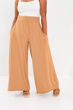 Slip into buttery-soft comfort with sophisticated style in our Vietnam Wide Leg Tie Bottom Pant. Crafted from eco-friendly bamboo fabric, the same luxurious material as our Everyday Travel Wrap, these pants are breathable, anti-bacterial, and odor-resistant, offering a fresh feel all day long. Designed for ultimate versatility, you can wear these pants in a flowing wide-leg silhouette, cinch them slightly for a more tailored look, or tie them all the way for a chic genie pant style. Perfect for Effortless Summer Loungewear Wide Leg Pants, Effortless Wide-leg Loungewear Pants, Flowy Elegant Rayon Bottoms, Effortless Summer Wide Leg Pants With Elastic Waistband, Non-stretch Wide Leg Pants For Loungewear, Comfortable Non-stretch Wide Leg Loungewear Pants, Rayon Wide Leg Pants For Day Out, Wide Leg Loungewear Pants With 4-way Stretch, Effortless Wide Leg Spring Pants