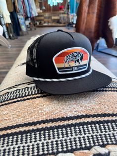 Black and Orange Bison Red Dirt Hat Co. Snap Back Hat Flat Bill Black Hat For Rodeo, Western Black Hat, One Size Fits Most, Western Black Hat One Size, Trendy Black Flat Bill Trucker Hat, Black Western Hat One Size Fits Most, Black Trucker Hat With Short Brim For Rodeo, Black Snapback Trucker Hat For Rodeo, Western Black Snapback Hat For Rodeo, Black Flat Bill Trucker Hat For Rodeo