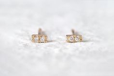 Experience elegance with our Classic Double Diamond Bar Earrings, featuring natural white diamonds set in 14k gold. These minimalist stud earrings are meticulously crafted from scratch, making them a perfect special gift for someone dear or a treat for yourself. DETAILS  * Natural Diamonds * Shape: Round * Diamond Measurements: Approx 1.3mm, 0.01ct each * Quality: G-H color, VS clarity. * Bar Measurements: Approx. 1.5mm wide, approx. 3.5mm long (0.06 Inch x 0.13 Inch) * Material: 14k Yellow Gold Minimalist Brilliant Cut Diamond Earrings, Minimalist White Diamond Earrings With Single Diamond, Minimalist White Diamond Earrings With Single Stone, Minimalist 14k Gold Diamond Earrings For Formal Events, Minimalist Diamond Earrings For Anniversary, Minimalist 14k Gold Single Diamond Earrings, Minimalist Yellow Gold Round Cut Diamond Earrings, Minimalist 14k Gold Diamond Earrings With Prong Setting, Minimalist 14k Gold Earrings In Diamond White