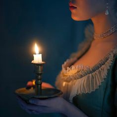 a woman holding a plate with a lit candle in it and the words good night my friend sweet dreams