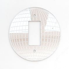 a white light switch plate cover with squares on it