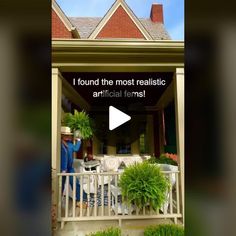 a man standing on a porch next to a planter filled with potted plants