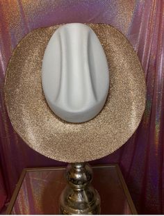 The “Golden Girl” hat features our white hat and champagne gold rhinestones. For those that prefer the look of gold over silver, this one is for you! This hat features: White straw hat Champagne gold rhinestones Brim Options: Underneath brim only features the underneath brim rhinestoned with champagne gold rhinestones and a matching champagne gold hat band around the crown Both brims rhinestoned have both brims (top and bottom) rhinestoned in champagne gold rhinestones with a matching champagne Gold Hats, Suede Hat, Camo Hats, Bridal Hat, White Hat, Black Hat, Pink Hat, Golden Girl, Gold Rhinestone