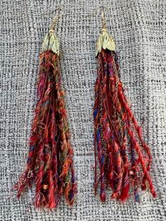 Unique mulitmedia very long dangle earrings with  rust sari silk yarn, cording, gold toned metal chain and a metal beadcap.  a great gift, boho style Bohemian Multicolor Tassel Earrings With Dangling Beads, Orange Bohemian Tassel Earrings With Dangling Beads, Bohemian Multicolor Long Drop Tassel Earrings, Handwoven Orange Bohemian Earrings, Sari Silk Yarn, Multicolor Hand-strung Bohemian Earrings, Long Dangle Earrings, Sari Silk, Silk Yarn