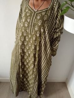 This Item is handmade. The fabric used is top quality cotton to ensure your skin is pampered and always natural. It is beautifully painted on with blocks- a traditional Indian style of printing.Each layered block by block,colour by colour, creating an exquisite design. The design is multi functional depending on your mood, Use it like a kaftan to lounge around the house in or even as a swim cover up for your day at the beach or pool. The second item and consecutive items of the same order are US Beige Long Sleeve Maxi Dress For Beach Cover-up, Oversized Long Sleeve Tunic For Beach Cover-up, Bohemian Beige Kaftan For Beach Cover-up, Beachwear Long Sleeve Maxi Dress For Festival, Long Sleeve Beachwear Maxi Dress For Festivals, Patterned Cotton Maxi Dress For Vacation, Green Bohemian Tunic Kaftan, Bohemian Beige Printed Maxi Dress, Traditional Cotton Dress With Kimono Sleeves