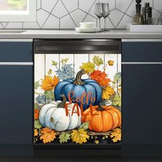 a dishwasher cover with pumpkins, leaves and the word fall on it