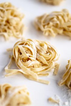 several uncooked pasta pieces on a white surface