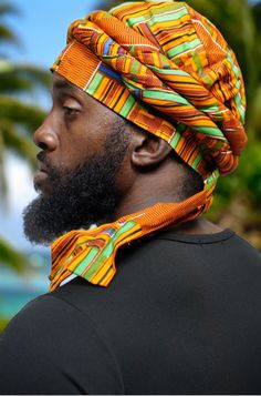 Imagining the vibrant colors of the African landscape, our uniquely crafted 100% cotton Kente Turban, affectionately named "Asase" after the Ghanaian earth goddess, is a true masterpiece by Dupsie's African Fashion. This pre-wrapped Turban in Orange, Green, Black, Off-White, Blue, and Burgundy African Print showcases the rich history and culture of African fashion, securing its place as a must-have accessory for men. The tradition of Turbans in African fashion dates back centuries, symbolizing n African Dashiki Shirt, African Tops For Women, African Pants, African Landscape, African Shoes, African Hats, Dashiki Shirt, African Tops, Blue And Burgundy