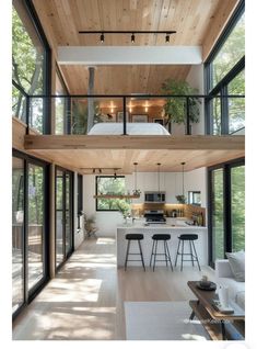 an open floor plan with high ceilings and lots of windows