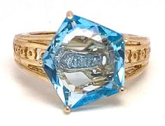 "Lady's vintage blue topaz and two-tone gold ring. Beautiful ring with an fancy cut blue topaz. This piece weighs approximately 5.7 grams, is stamped \"14K China\", and ring size is approximately 7.  It is in good condition and would make a beautiful addition to your vintage jewelry collection." Etsy Gold Ring, Beautiful Ring, Rings Statement, Blue Topaz, Beautiful Rings, Gold Ring, Statement Rings, Topaz, Two Tone