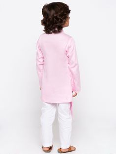 JBN CREATION Boys' Pink Cotton Silk Kurta and Pyjama Set Dress your little one in style and comfort with this kurta pyjama set from JBN Creation. Made from a blend of cotton and silk, this set features a pink kurta with a mandarin collar, long sleeves, and a button placket. The pyjamas are white and have an elasticated waistband for a comfortable fit. Key Features Pink kurta with mandarin collar and long sleeves White pyjamas with elasticated waistband Cotton silk blend fabric for comfort and style Specifications Material: Top - Cotton Silk Blend, Bottom - Pure Cotton Fit: Regular Material & Care Top fabric: Cotton silk blend Bottom fabric: Cotton Dry clean recommended Legal Disclaimer: The product is guaranteed to be 100% genuine. Product images are for illustrative purposes only. Images/ Pink Cotton Sleepover Set, Pink Cotton Sets For Festive Occasions, Traditional Pink Long Sleeve Pant Set, Pink Long Sleeve Bedtime Set, Cotton Long Sleeve Pant Set For Eid, Long Sleeve Cotton Pant Set For Eid, Festive Long Sleeve Loungewear Pant Set, Festive Pink Long Sleeve Sets, Pink Long Sleeve Festive Set