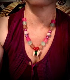 "This is a hand beaded pink glass and frosted rainbow 🌈 candy colored bead necklace with an adorable little Piggy rapped in silk crimson thread. So bright and cute 🥰 Hangs on a 18\" 18k gold plated chain. Please let me know if you would like a cute: ⭐️ Piggy 🐷 Necklace  ⭐️ Elephant 🐘 Necklace ⭐️ Zebra 🦓 Necklace ⭐️ Girrafe🦒 Necklace" Pink Beaded Necklace With Tiny Beads For Gift, Pink Single Strand Bohemian Beaded Necklaces, Pink Bohemian Single Strand Beaded Necklaces, Bohemian Pink Single Strand Beaded Necklaces, Playful Pink Necklace For Festival, Playful Pink Necklaces For Festivals, Pink Glass Beaded Necklaces For Gift, Pink Glass Beaded Necklace For Gift, Pink Glass Beaded Chain Jewelry