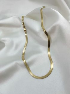 Get the classically elegant look of herringbone designs with the Premium Herringbone Necklace. This gorgeous 18-inch-long necklace is fashioned out of stainless steel and plated with 14 karat gold to give it an opulent appearance. It is both hypoallergenic and tarnish-free for comfortable wear and a long life. - Elegant 14 karat gold-plated stainless steel necklace - Water resistant to avoid moisture damage - Hypoallergenic - Resistant to tarnishing Elegant Metal Herringbone Clavicle Necklace, Elegant Herringbone Clavicle Necklace, Gift Herringbone Necklace With Delicate Metal Chain, Formal Gold Herringbone Necklace With Adjustable Chain, Classic Gold Snake Chain Necklace, Classic Gold-plated Herringbone Necklace, Classic Gold Herringbone Necklace, Classic Gold Herringbone Necklace With Delicate Chain, Gold Plated Clavicle Style Herringbone Necklace